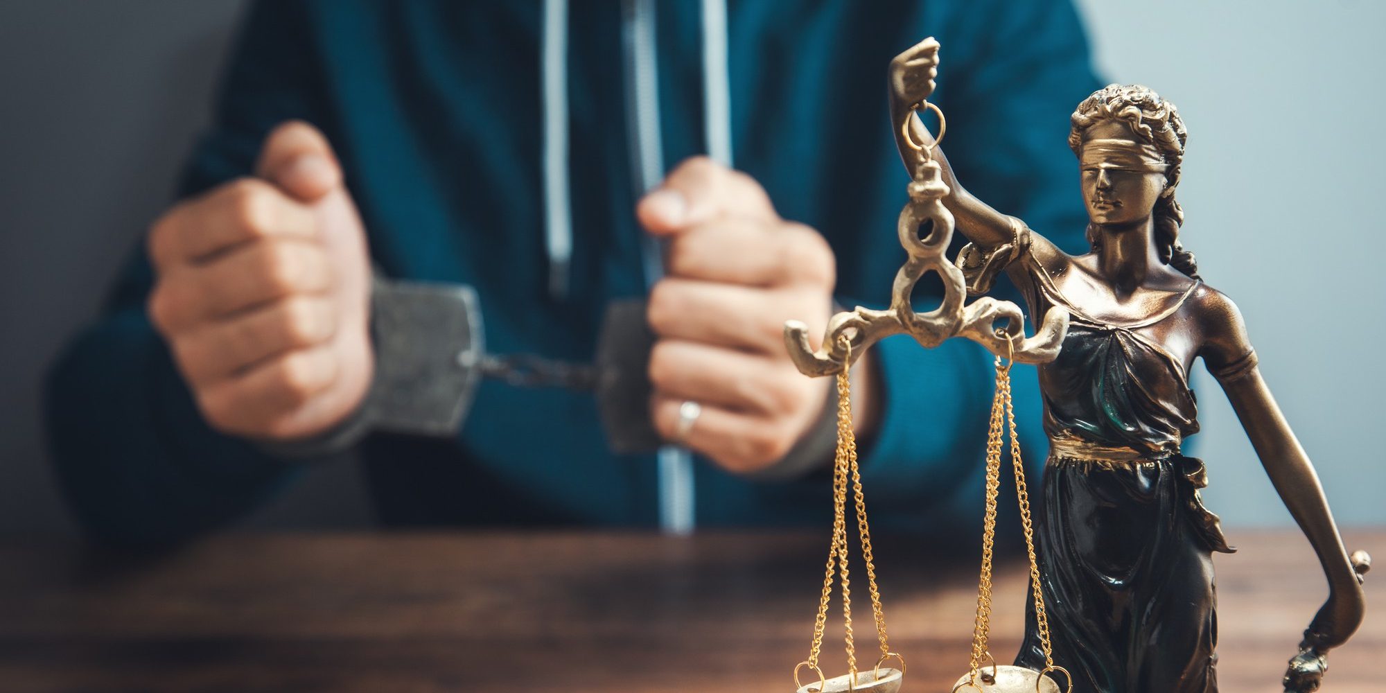 justice-lady-man-handcuffs-table
