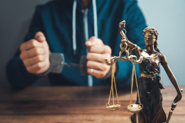 justice-lady-man-handcuffs-table