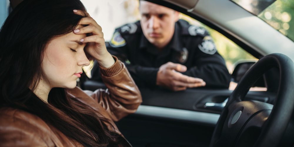 male-cop-uniform-check-female-driver-road